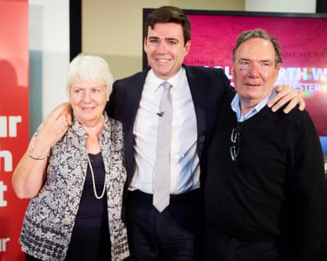 Andy Burnham with his parents Eileen and Roy, all smiling warmly together indoors